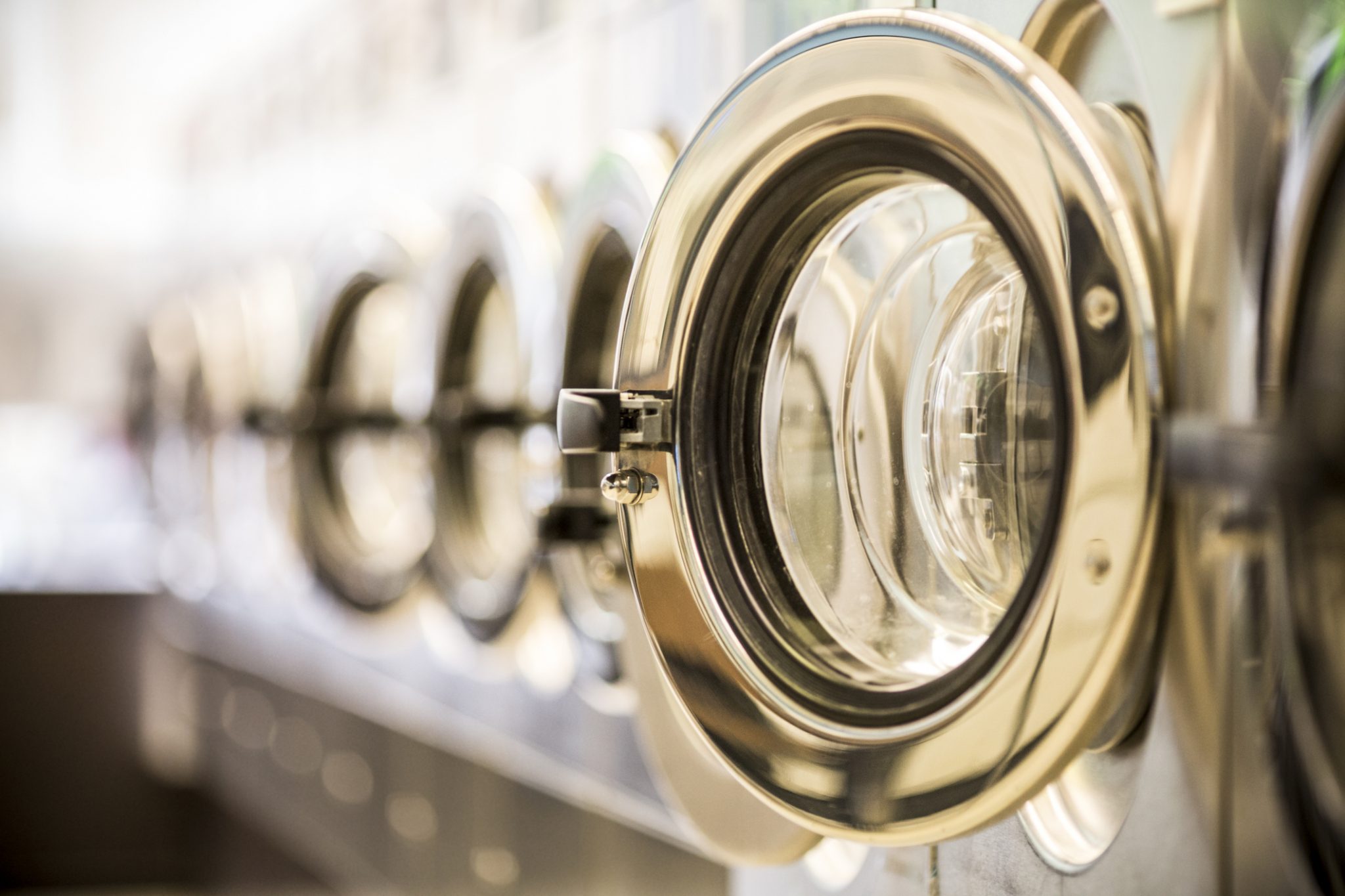 Washing Machines Clothes Washer’s Door In A Public Launderette