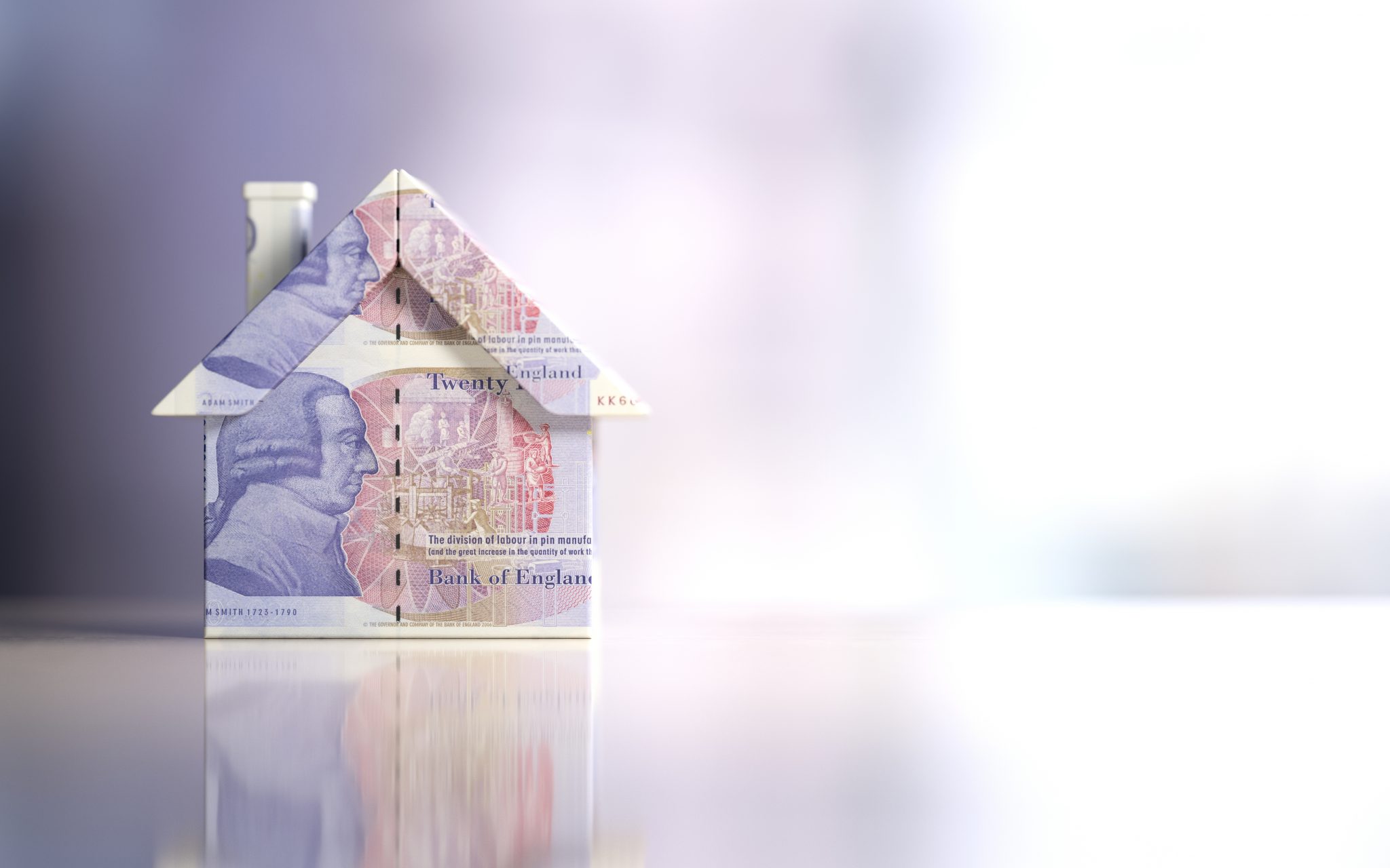 Tiny House Model Textured With Twenty British Pound Banknotes On Reflective Surface