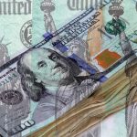 Federal Treasury Checks Over Stack Of Us Currency