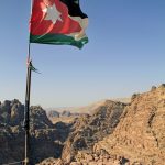 The National Flag Of Jordan Over Petra
