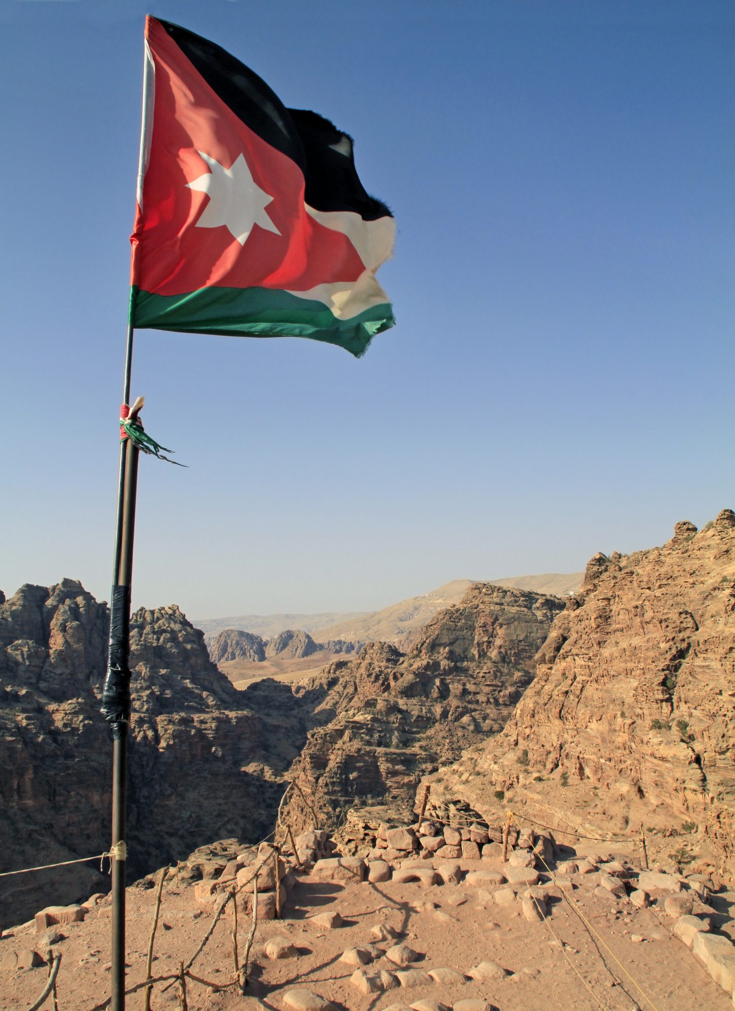 The National Flag Of Jordan Over Petra