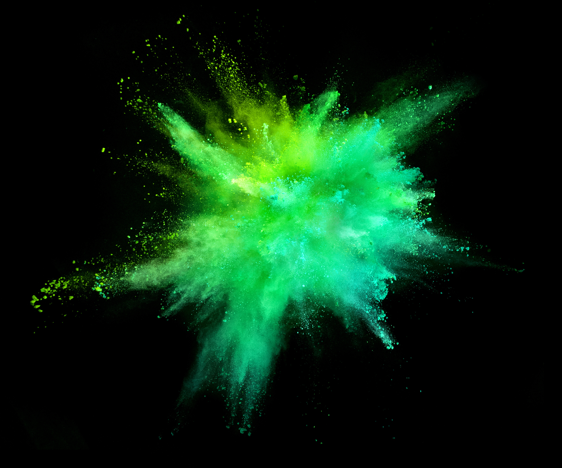 Explosion Of Coloured Powder On Black Background